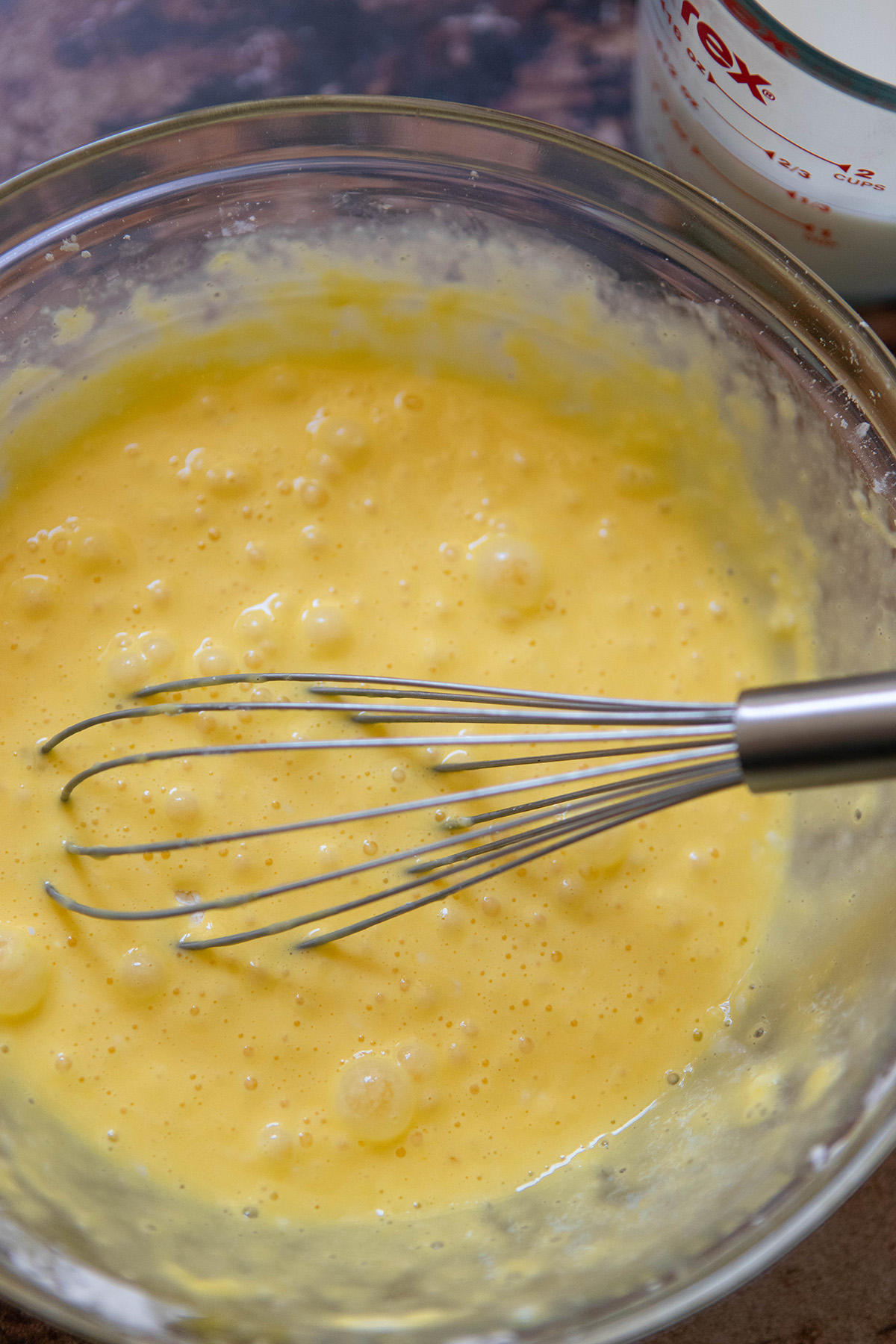 whisked eggs and cornstarch in a glass bowl