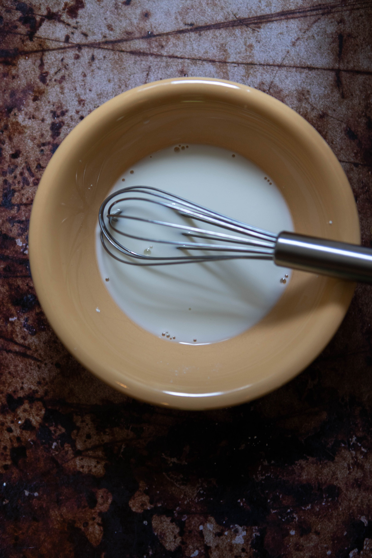 cornstarch mixed with water in a yellow bowl