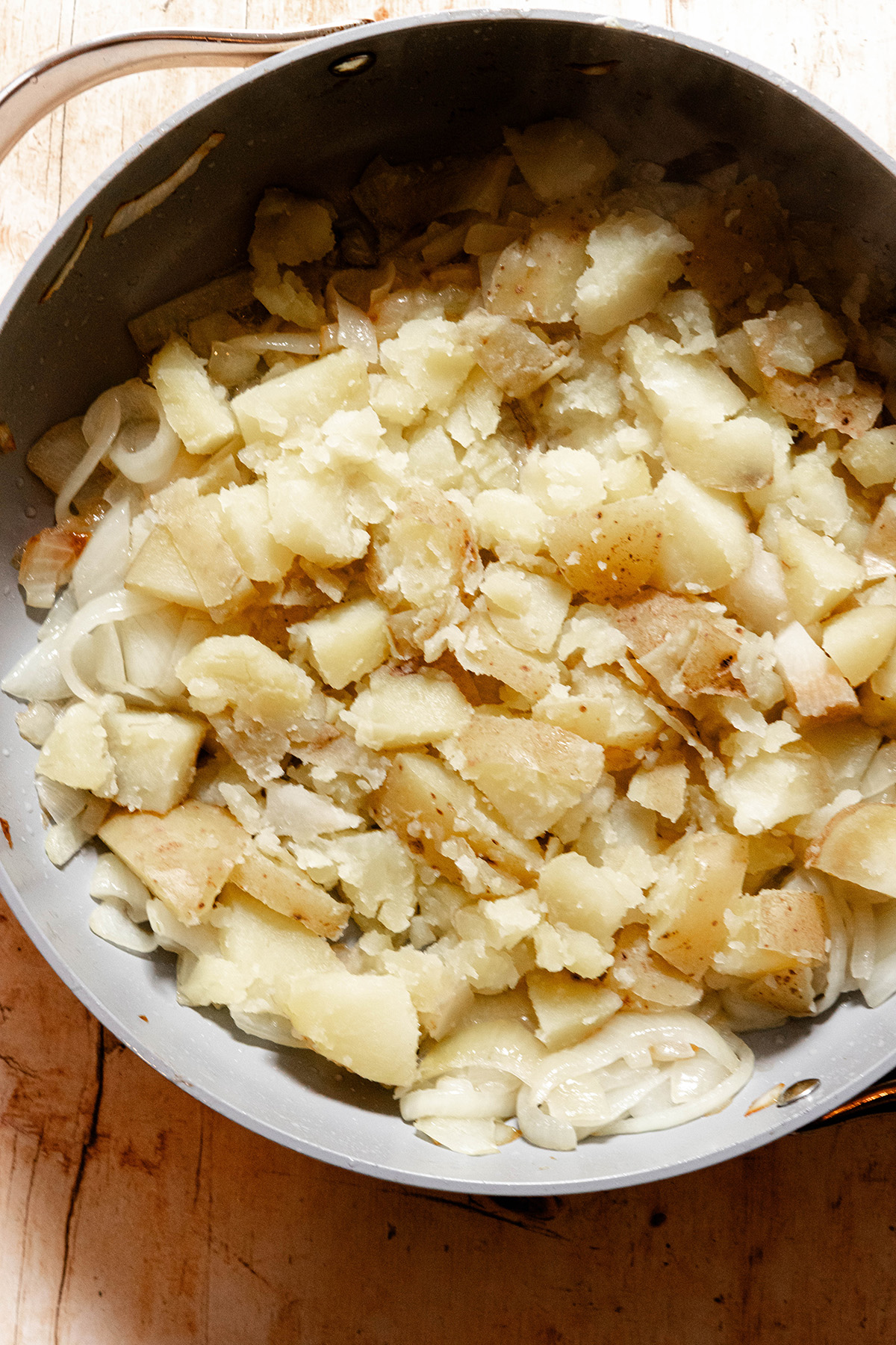 potatoes and onions in a pan