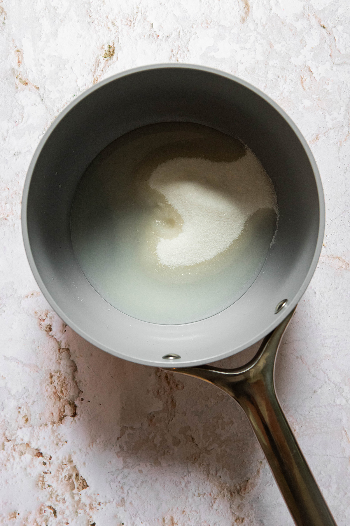 sugar and water in a pot to make caramel
