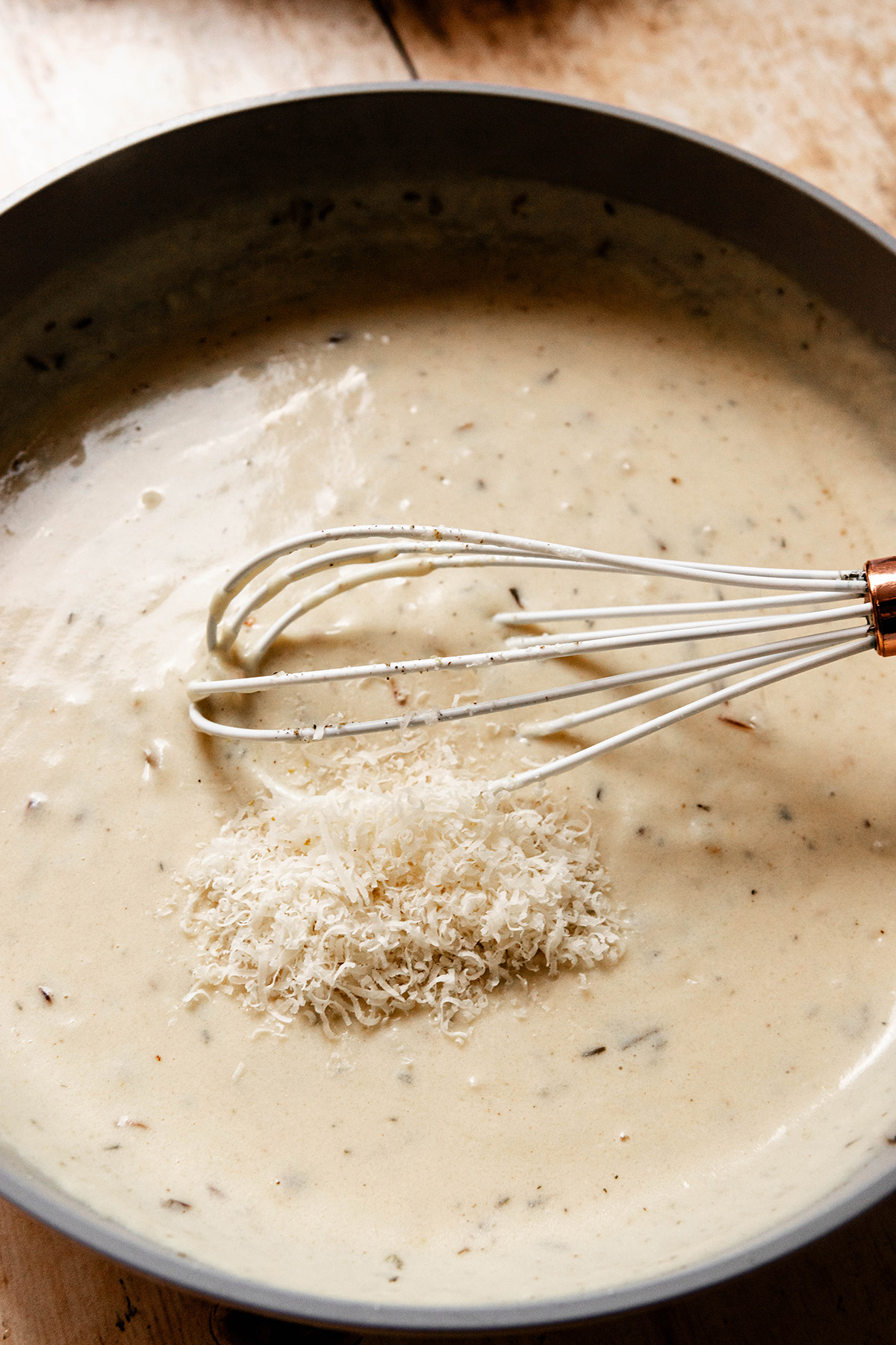 sauce in a pan with parmesan