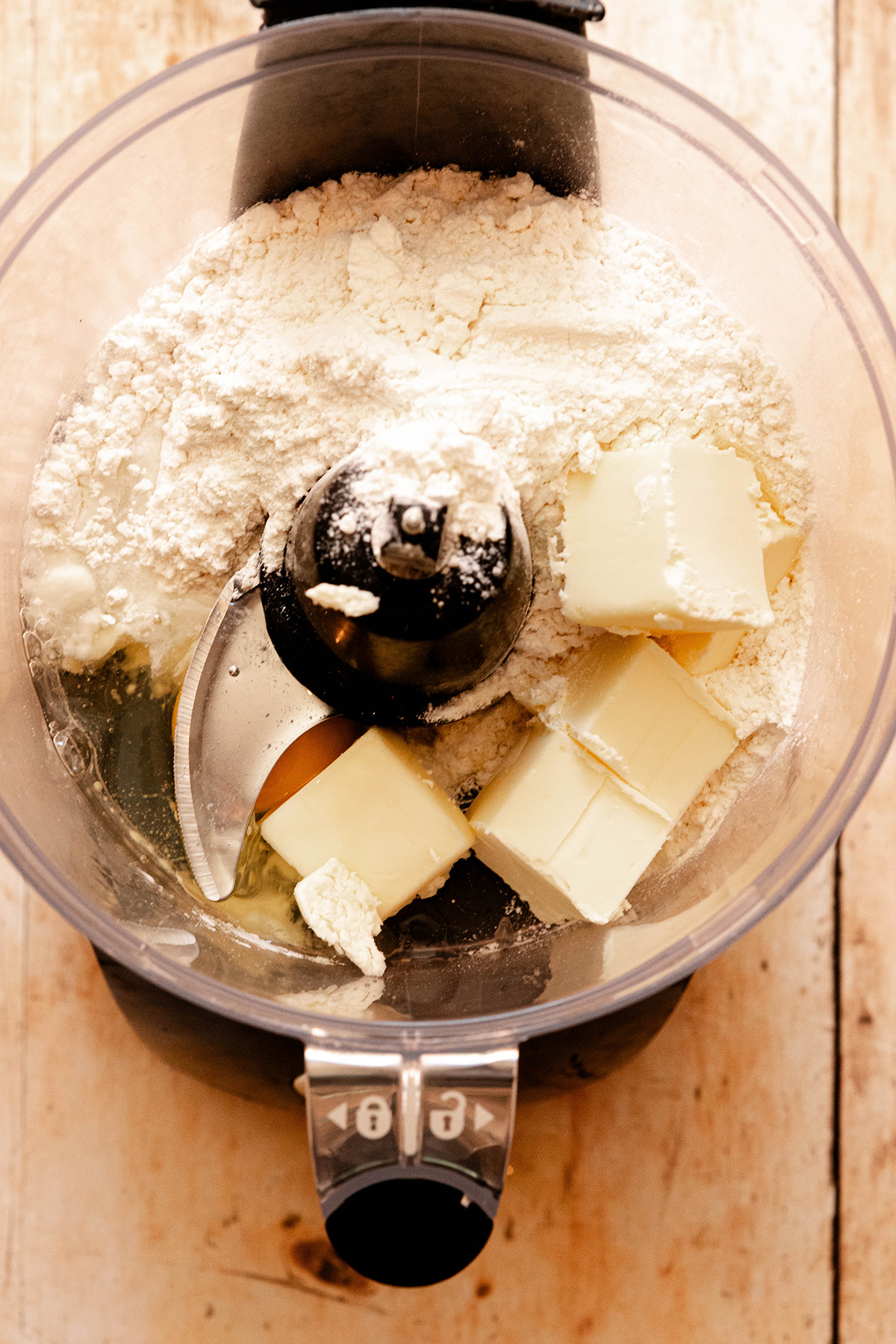 food processor with dough ingredients inside