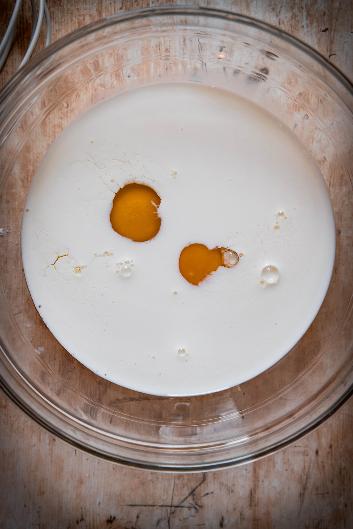 half and half and eggs in a bowl