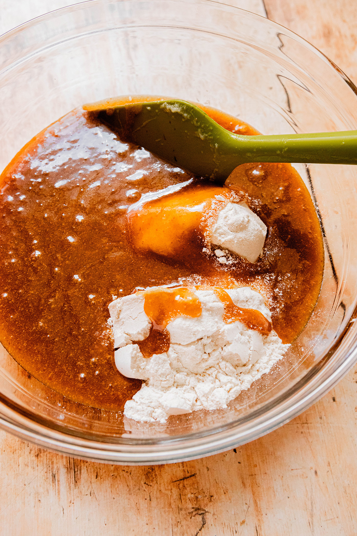 wet and dry ingredients in a glass bowl