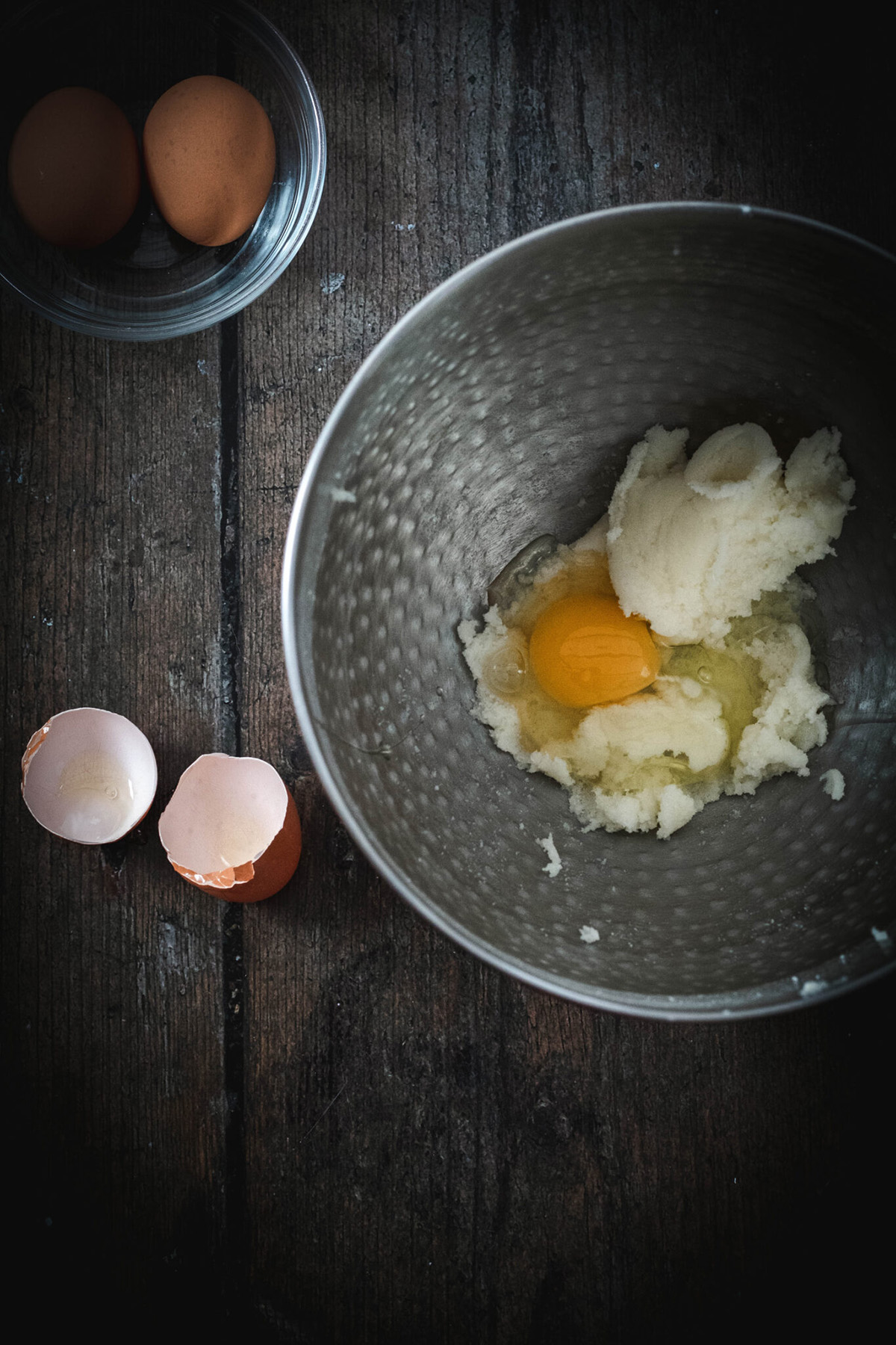 creamed butter and sugar, with eggs in a mixing bowl