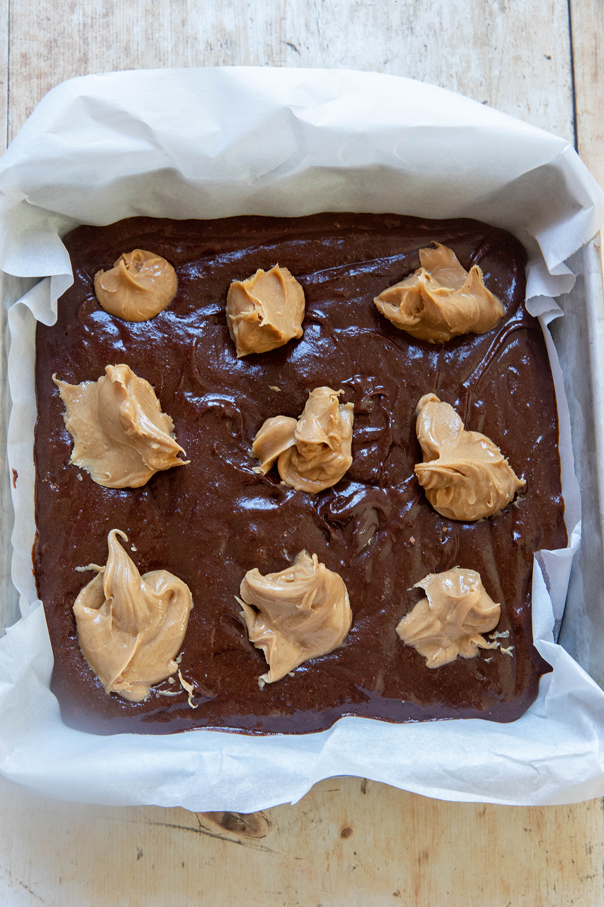 One Bowl Gluten Free Peanut Butter Brownies Recipe batter with peanut butter on top