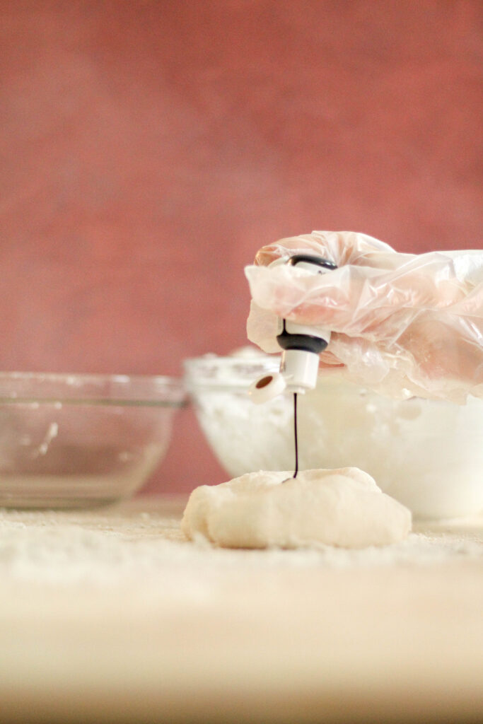 food coloring being squeezed onto fondant