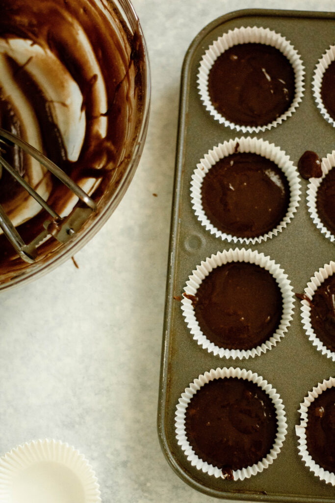 cupcake batter in cupcake fillers