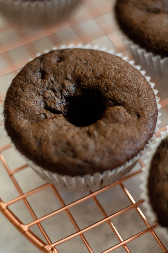 chocolate cupcake on a brass tray