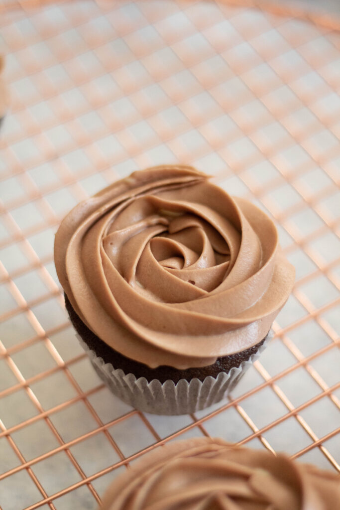 chocolate cupcake on a brass tray