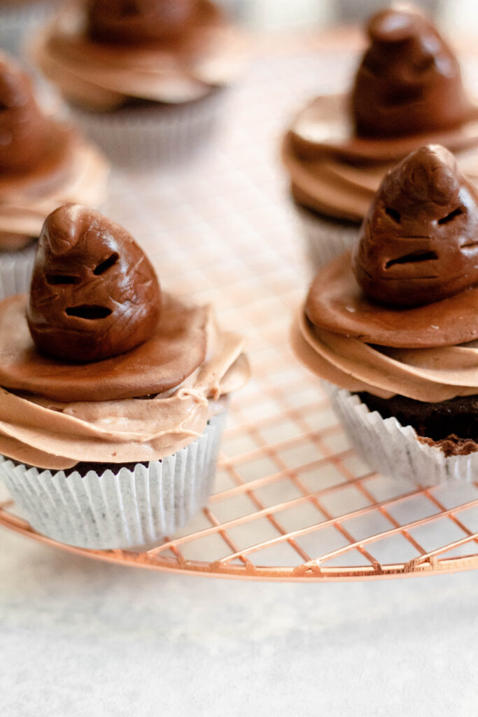 Sorting hat cupcakes sitting on a brass tray