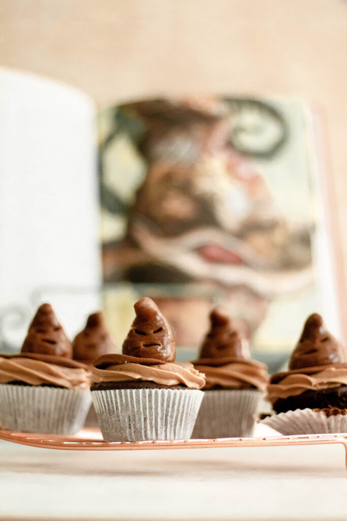Harry Potter Book sitting behind sorting hat cupcakes