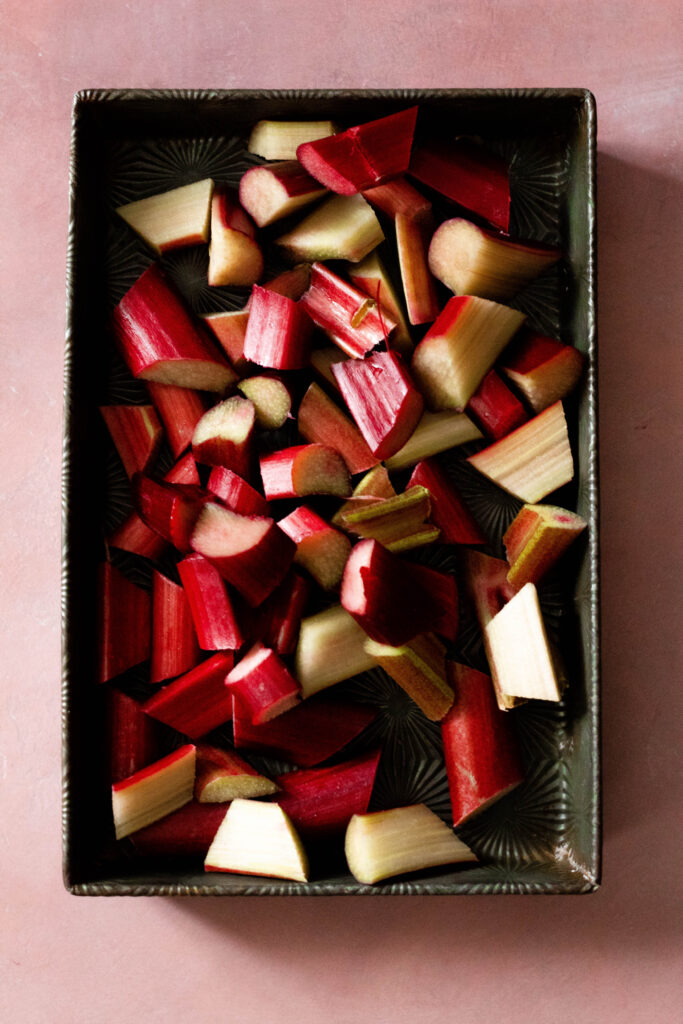 Rhubarb Tart Recipe on a pink background.