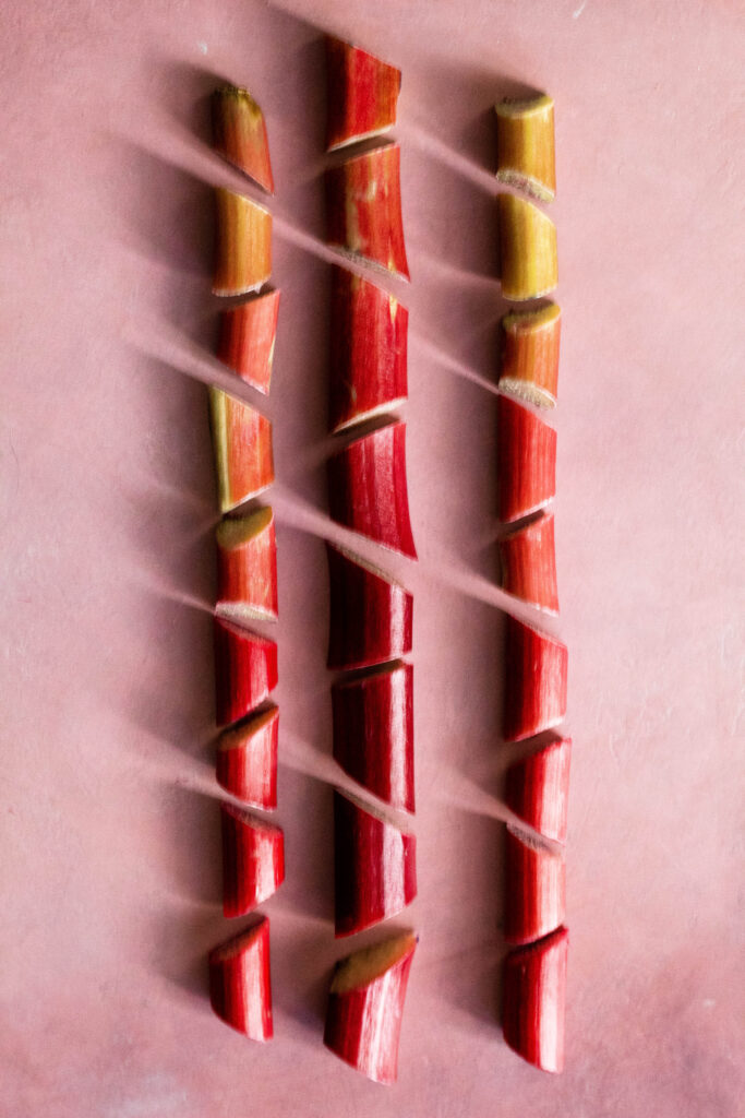 Rhubarb Tart Recipe on a pink background.