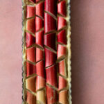 Rhubarb Tart Recipe on a pink background.