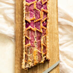 Rhubarb Tart Recipe on a wooden board.