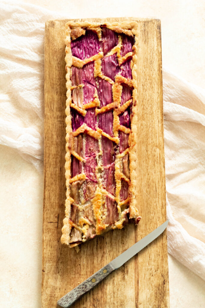 Rhubarb Tart Recipe on a wooden board.