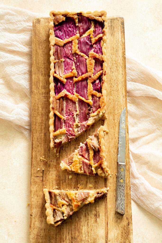 Rhubarb Tart Recipe on a wooden board.