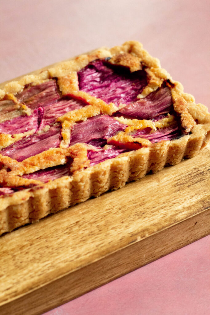 Rhubarb Tart Recipe on a wooden board.