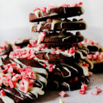 mint cookies with chocolate chips stacked on each other