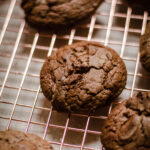 Gluten Free Tahini Chocolate Chip Cookies on a wire rack