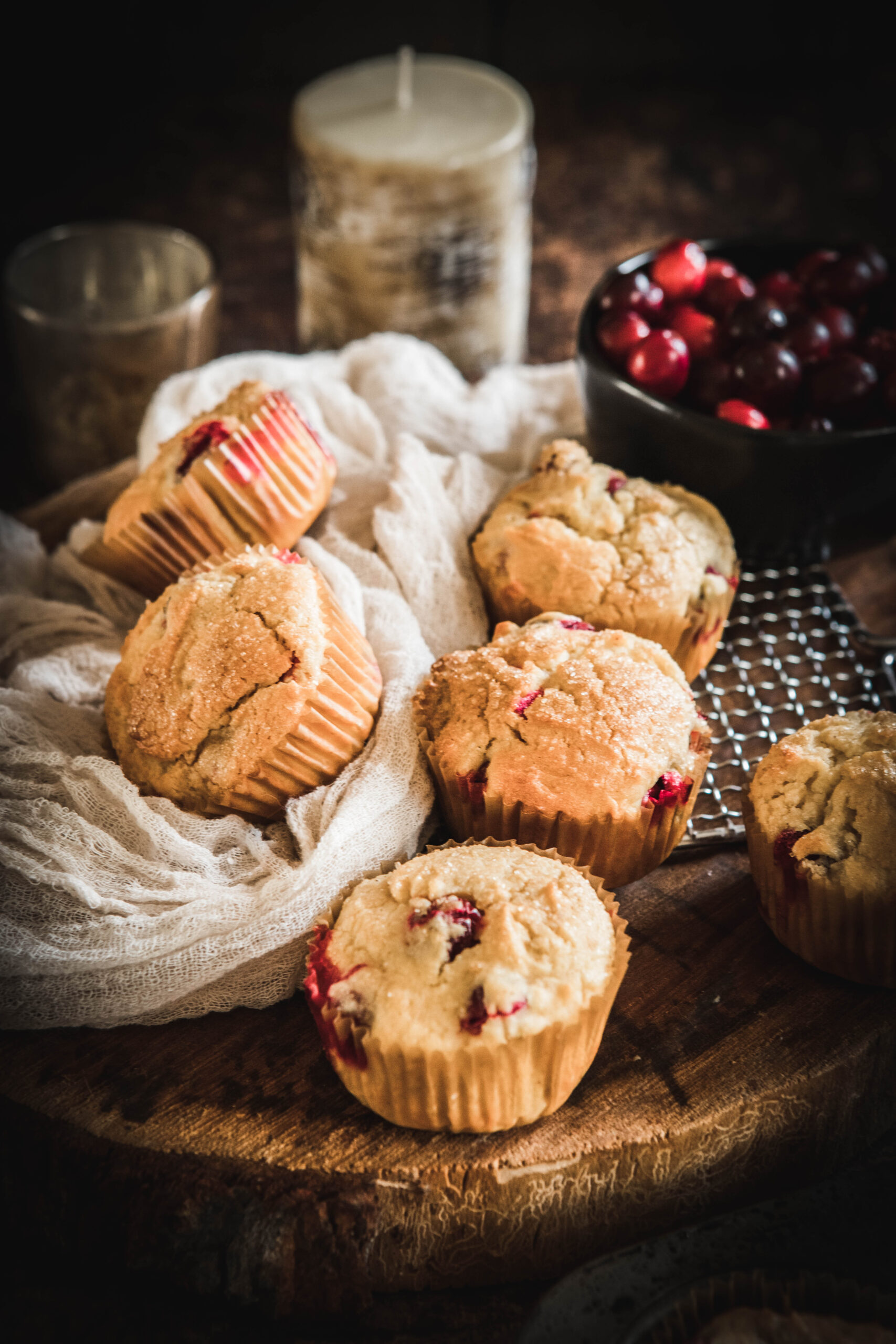 Gluten Free Cranberry Orange Muffins on a wooden slab