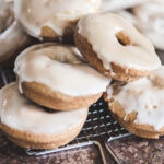 maple doughnuts on a metal tray
